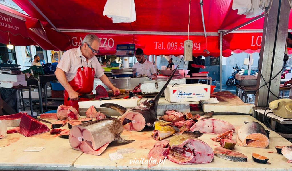 Vendor at a fish market in Catania