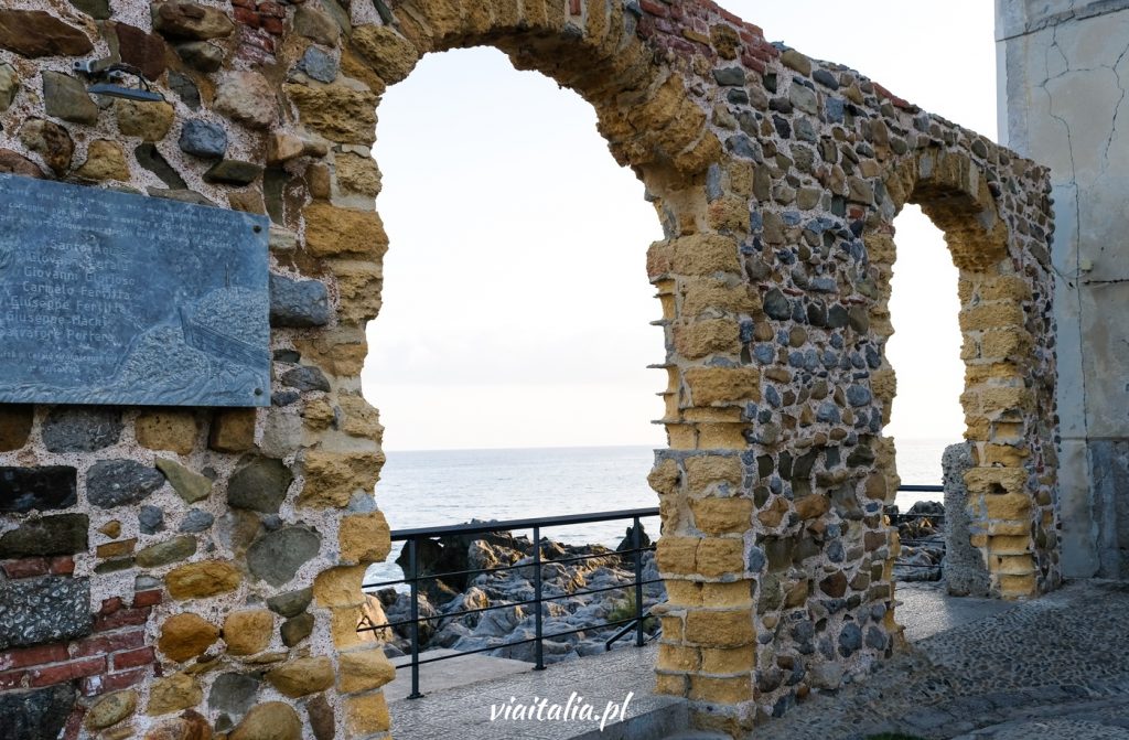 Stone gate in Cefalu overlooking the sea